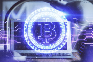 Multi exposure of blockchain and crypto economy theme hologram and table with computer background....