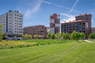 Fototapeta na wymiar View of apartment buildings and a park in the Salburua quarter, Vitoria-Gasteiz, Basque Country, Spain