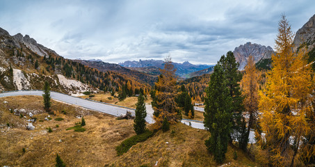 Obraz premium Overcast morning autumn alpine Dolomites mountain scene. Peaceful Valparola Path view, Belluno, Italy.