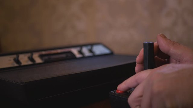 Playing With Vintage TV Video Game Console Joystick. 4K Footage