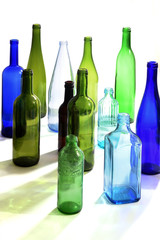 group of bottles scattered on a white background