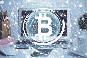 Multi exposure of blockchain and crypto economy theme hologram and table with computer background. Concept of bitcoin cryptocurrency.