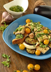 Eggplant with mozzarella, croutons, cilantro pesto and walnuts, vertical 