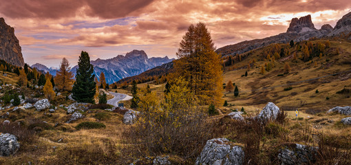 Overcast morning autumn alpine Dolomites mountain scene. Peaceful view near Valparola and Falzarego...