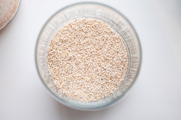 Beautiful cereals in a glass can on a white background