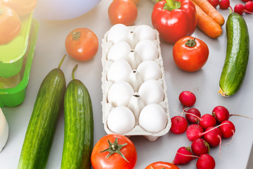 healthy food background, vegetables, fruits, eggs and dairy products on white table, top view