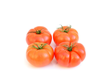 Red fresh tomatoes with green leaves  on white background, good for body and healthy,