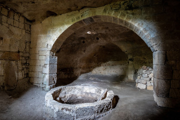 an ancient underground oil mill to produce extra virgin olive oil in Masseria Jesce, an ancient...