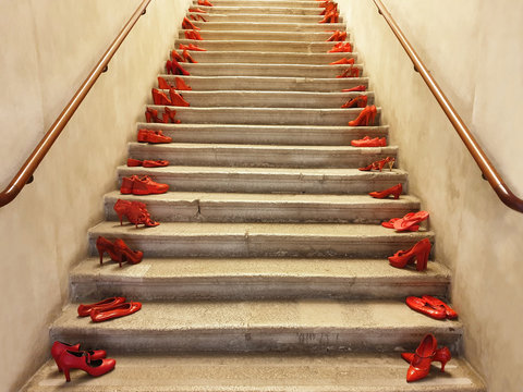 Red shoes on the steps. Demonstration against violence against women.