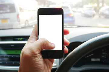 Close up man hands using smartphone in automobile