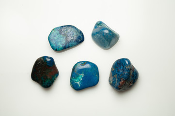 Blue shattuckite cabochon on the white background