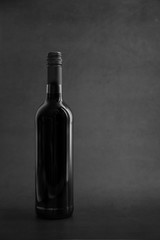 One elegant wine bottle in a black background