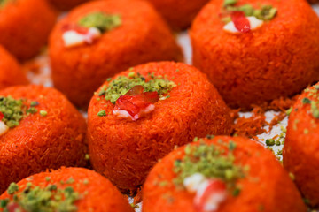 A slice piece of Esmalliyeh Arabic sweets & Ramadan dessert in a white sweet cream