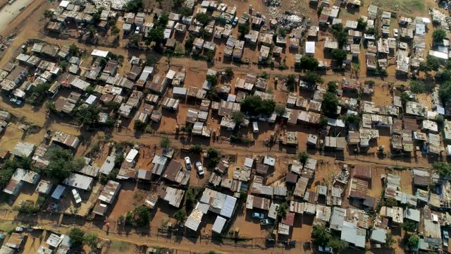 Aerial view of an informal settlement in Soweto, South Africa. Also known as a squatter camp or shanty town, these settlements are characterised by impoverished communities living in shacks. 