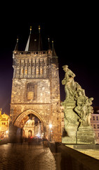 Fototapeta na wymiar Night view of the Charles Bridge tower in Prague