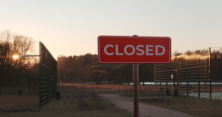 Park with sport fields closed at coronavirus quarantine lockdown. Covid 19 stop and cancel sports and recreation. No entry sign.