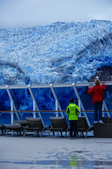 Woman trying to take photo of Tempanos Glacier and ice field in the region of Los Glaciares in the...