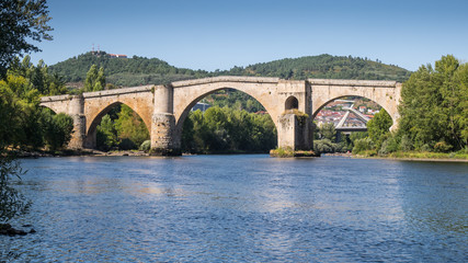 Fototapeta na wymiar Roman bridge over the Miño River in Ourense, Galicia, Spain
