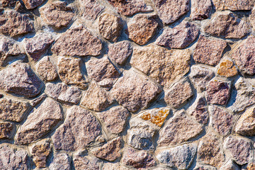 The texture of the stone wall. The wall of a large old house.