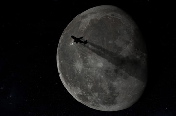 Airplane flying across a full moon.