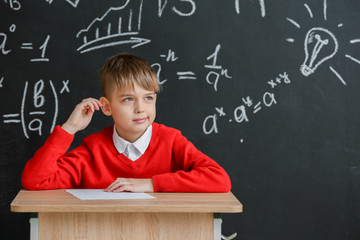 Pupil passing exam at school