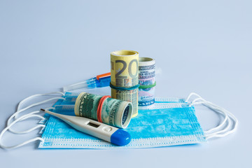 Banknotes of American and European currency among medical products and items.