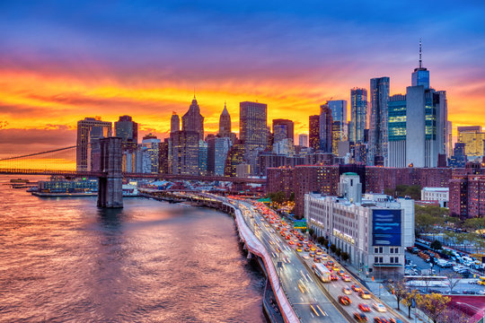 View of Lower Manhattan with Brooklyn Bridge at Sunset, New York City