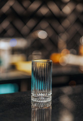 Before making iced americano, a glass of ice thrown
