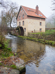 Fototapeta na wymiar Knollmeyer mill in the Nettetal valley near Rulle, Wallenhorst, Osnabrueck-Land, Lower Saxony, Germany