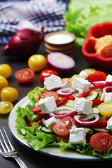 A plate full of bright fresh vegetable salad