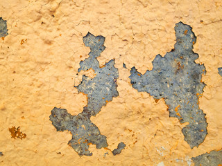 Concrete is puttied and painted with yellow paint. Retro ruined wall, exposure to moisture and...