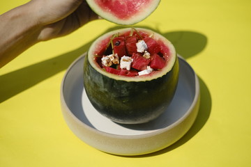 Watermelon Rocket Feta Salad served in watermelon shell, cool idea for eco-friendly food packaging