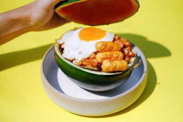 Yummy fried rice in watermelon shell container, cool idea for eco-friendly food packaging