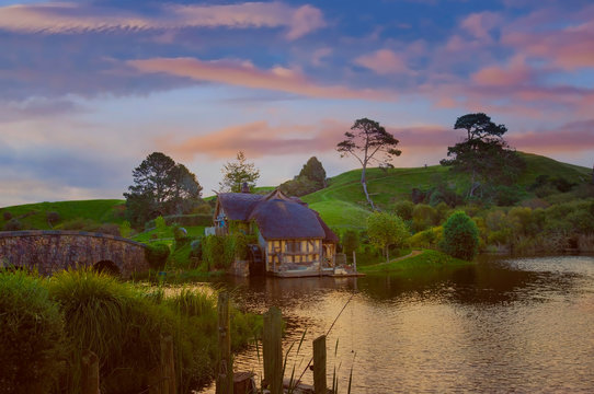 MATAMATA- NEW ZEALAND -APRIL -19- 2019 : Hobbiton - movie set created for filming the Lord of the Rings and "Hobbit" movies - Matamata, New Zealand,evening scene with twilight sky image
