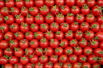 Red fresh ripe cherry tomatoes pattern background