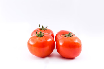 red ripe tomatoes isolated on white background