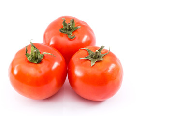 red ripe tomatoes isolated on white background