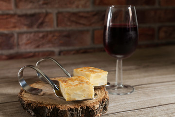 Spanish omelette brochettes and red wine glass