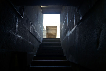 Old stone stair case in the ancient temple. Stair case in dark. Ancient stone stairs that form a beautiful background.