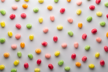 Small round candy-colored pastels on pastel background.