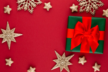 Christmas, holiday present box on red background.