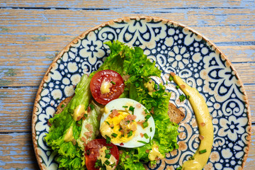 Homemade toasted bread with letucce salad,tomatoes,egg and mustard