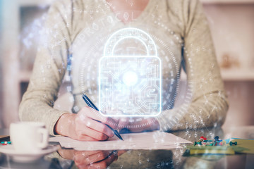 Multi exposure of woman's hands making notes with lock icon. Concept of security and protection of data