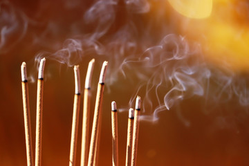 Incense burning in an ancient asian temple