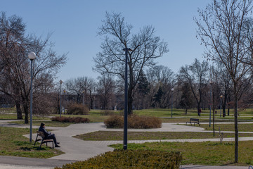 A man alone in an empty park during a pandemic lockdown