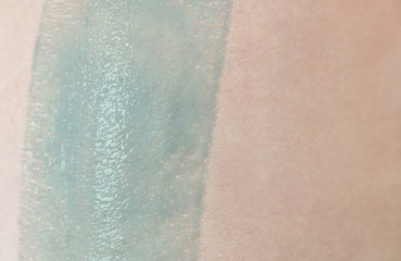 Female skin with hair and wax for depilation. Beauty and skin care concept.