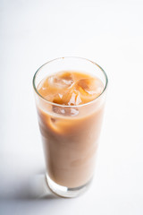Iced coffee with cream on the rustic background. Selective focus. Shallow depth of field.
