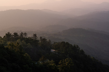 Twilight, sunrise and sea of fog in the morning on the mountains of northern Thailand, during the rainy season.