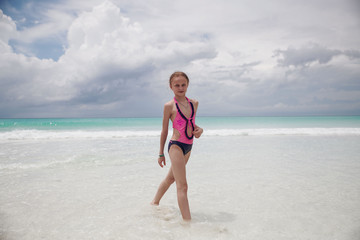 children have fun playing on the beach