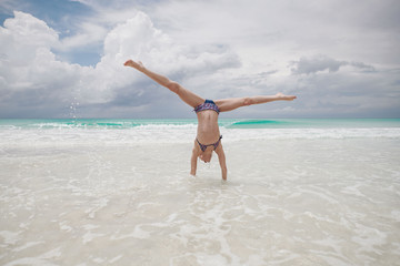 children have fun playing on the beach